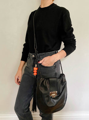 Preloved black leather bag with tassel detail by Jimmy Choo.